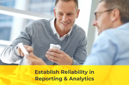 Two men smiling over a report