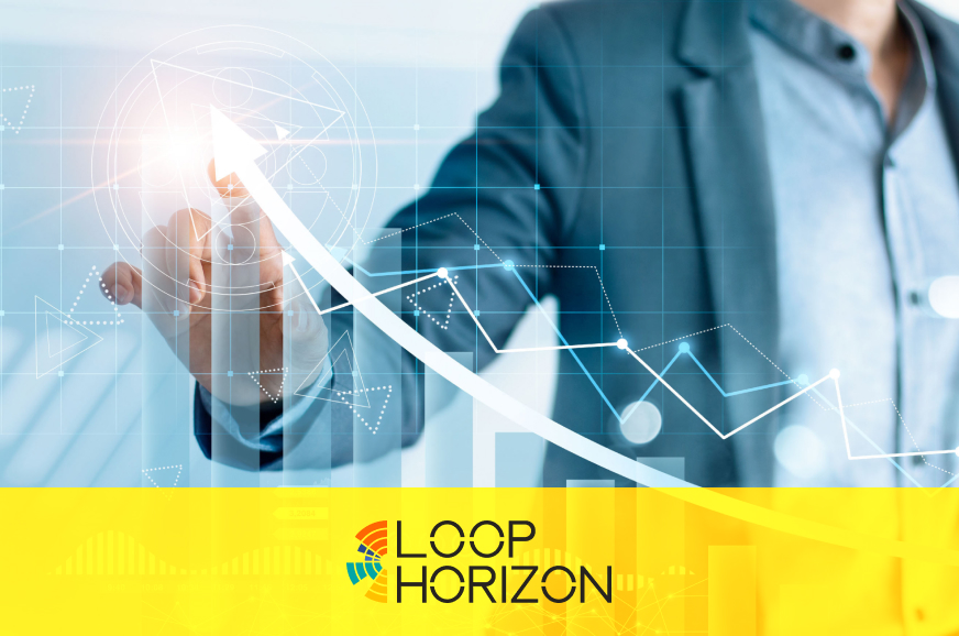 Man in a suit tracing line over graph chart with hand