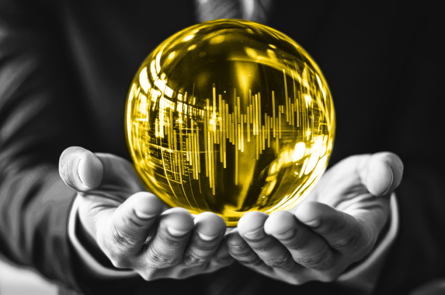 A man holding a yellow orb containing graphs and terminal output