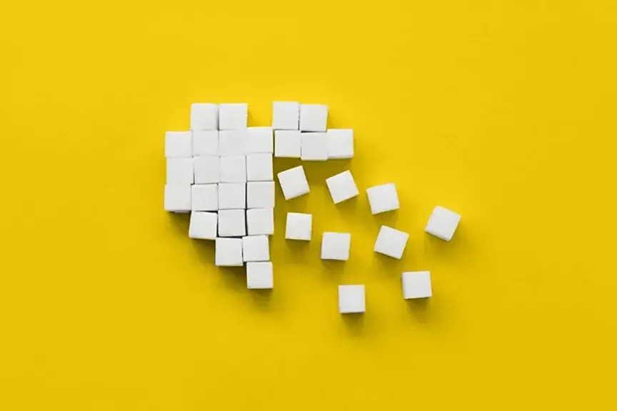 Small wooden squares spreading out from a cohesive shape