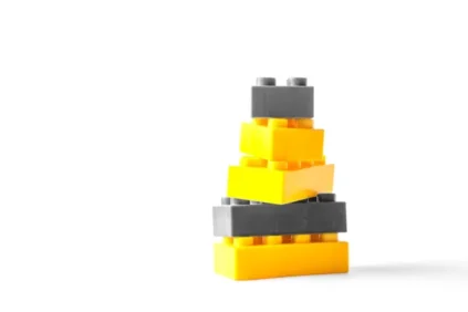 Stack of yellow and black legos