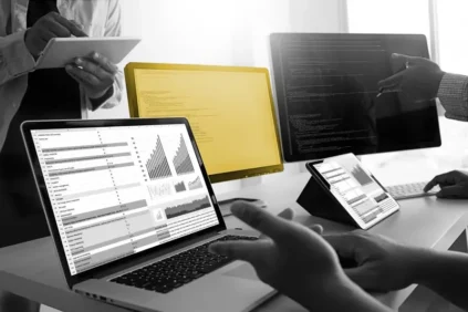 laptop and monitors on a desk