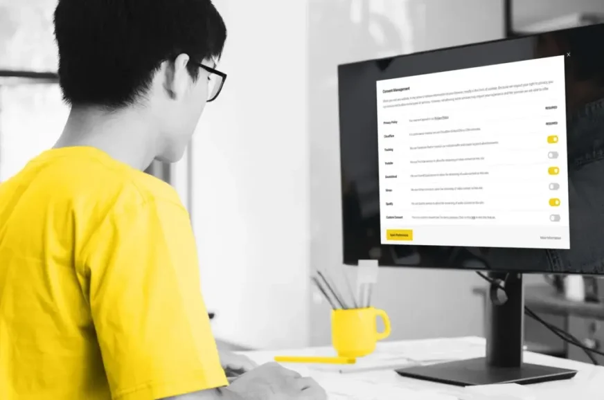 Man looking at monitor with report