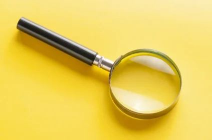 magnifying glass on a yellow background
