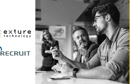 Three people talking in conference room