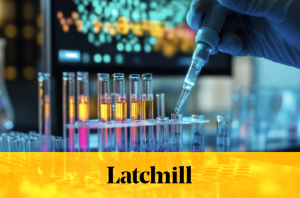 Dropper inserting test tubes filled with yellow and pink liquid