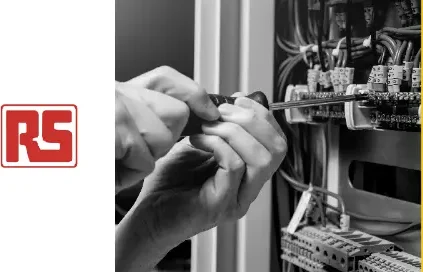 Hands using tools to make adjustments in a wiring closet