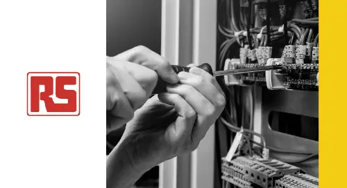 Hands using tools to make adjustments in a wiring closet